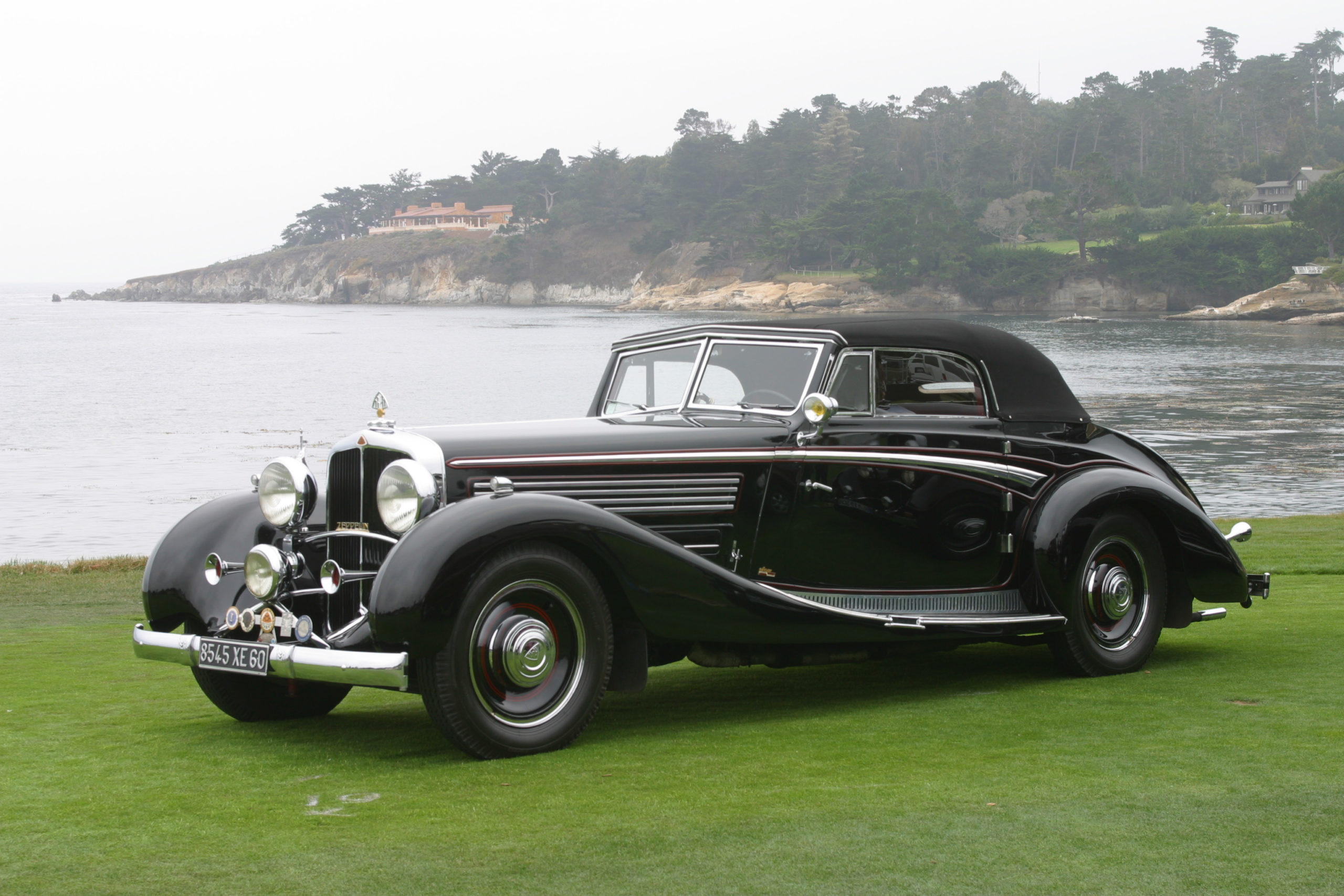 A classic Maybach on the lawn at Pebble Beach